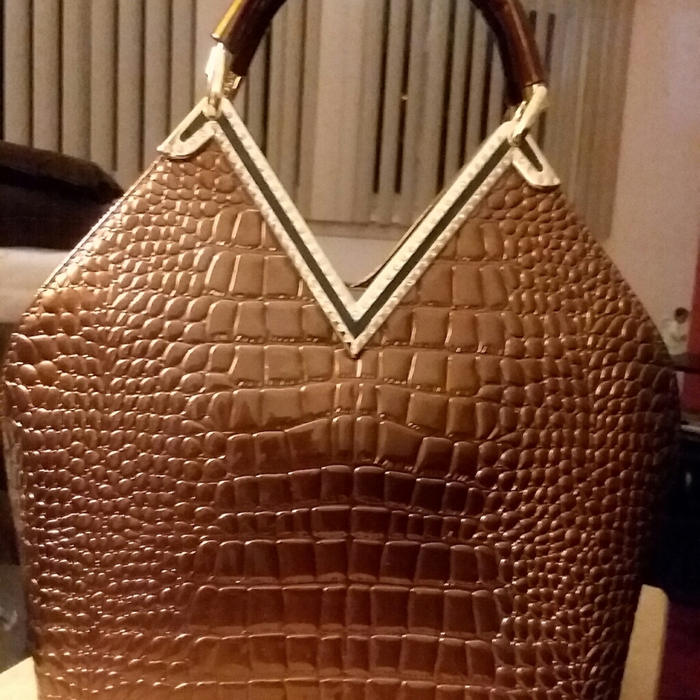 Brown patent leather purse with rhinestone trim
